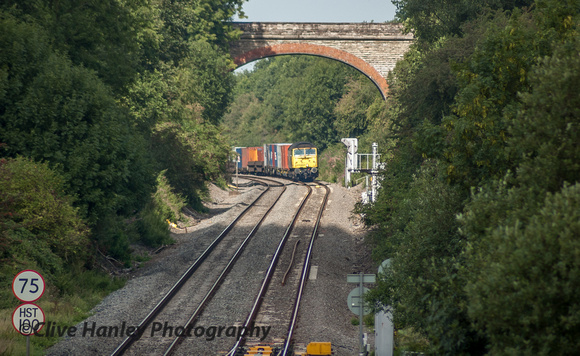 A container freight appeared hauled by Class 57 no 57007 appeared around the bend.