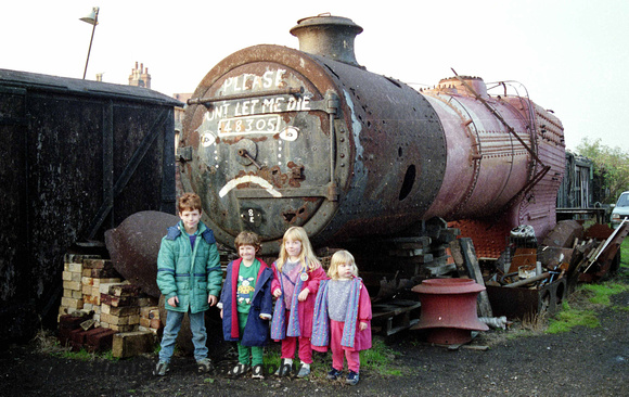 My two daughters (right) with my school friend, Alan's, children  with Stanier 8F no 48305. 1988ish?
