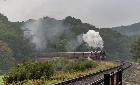 Stanier Princess Coronation Pacific 46233 Duchess of Sutherland climbs away from Victoria Bridge going north.