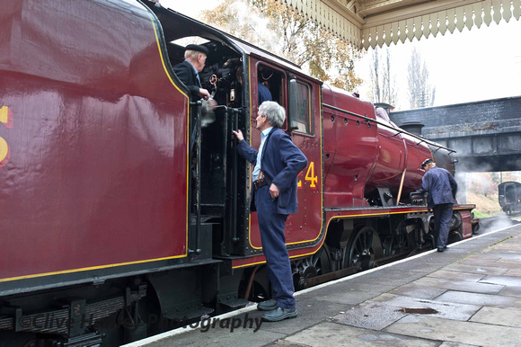 The crew check over the loco in the station