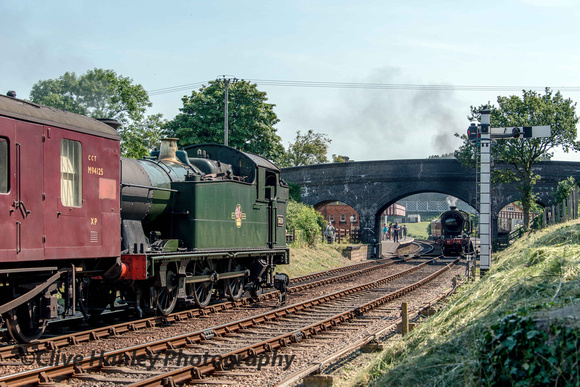 GWR 0-6-2T no 5619 descends towards the station at Weybourne while 8572 awaits departure