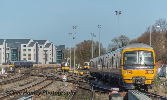 165129 then reverses into the up carriage sidings while a recent arrival at the station occupies its former location.