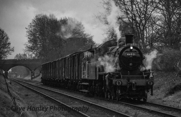 As rain began to fall under dark skies 46521 passes with the goods train from Swithland