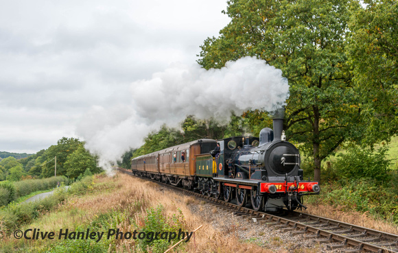 At Orchard Crossing Worsdell 0-6-0 no (564) 65462 heads past with the 12.20 from Arley