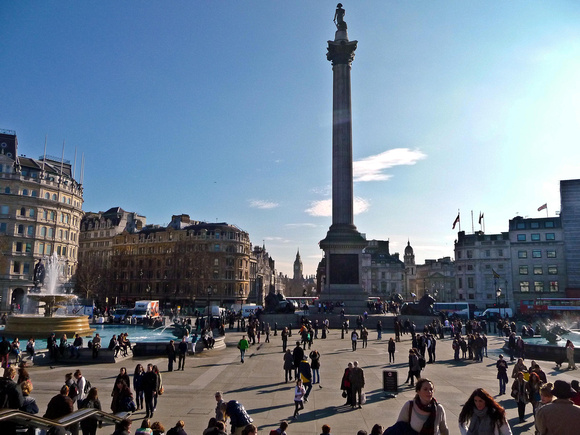 Nelson's Column stands in Trafalgar Square looking towards The Houses of Parliament.