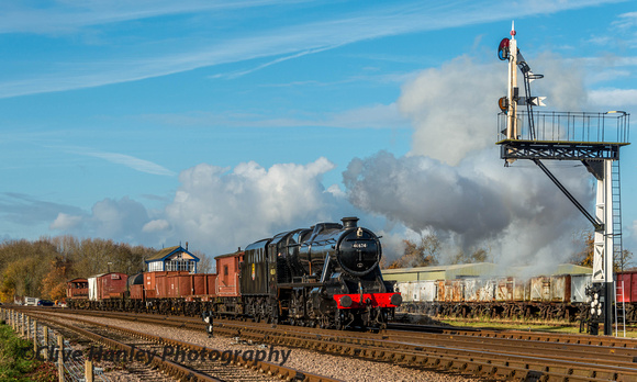 Stanier 8F no 48624 begins to slow down as the driver prepares to propell the freight into the sidings,