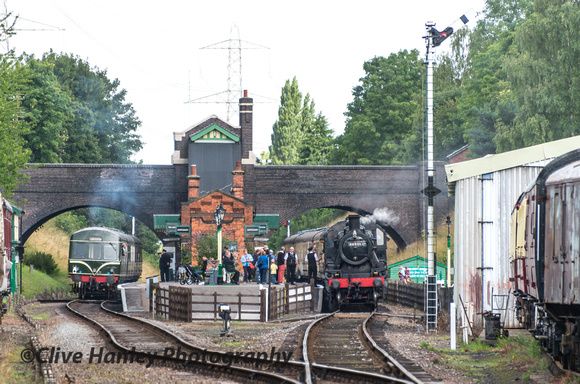 The 3-car DMU departs Rothley towards Quorn while 46521 stands at the southbound platform.