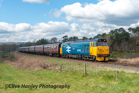 The Class 50 no 50049 Defiance climbs towards the tunnel mouth.
