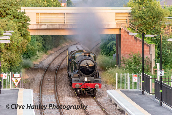 ex GWR Collett 4-6-0 no 5029 Nunney Castle accelerates through the newly constructed Stratford Parkway station.