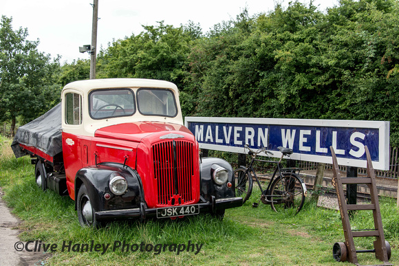 Another working lorry was parked up in the long grass adjacent to a Malvern Wells station sign? What's that about?