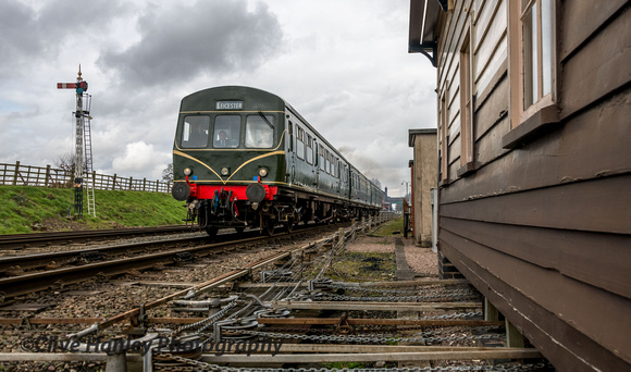 The DMU departs Quorn and passes the rods and cables of the Quorn box.