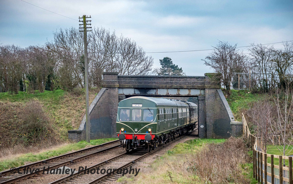 An attractive wooden fence has been installed on the north side of Woodthorpe bridge as the DMU returns from Leicester.