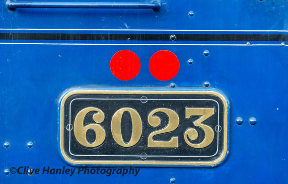 6023 numberplate and its two red dots indicating an axle load of 22tons10cwt.(50,400lbs)