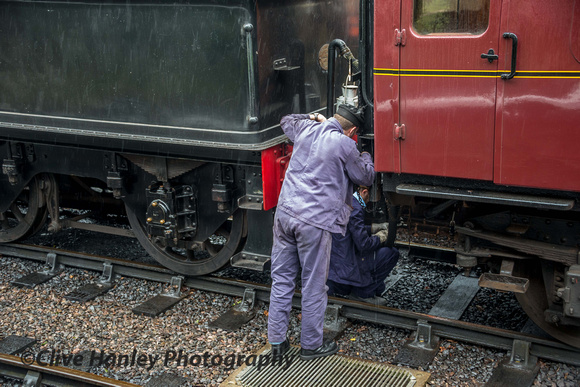 A trainee was being shown how to attach the coupling, steam heating and vacuum braking pipes.