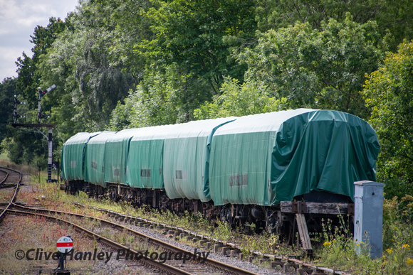 Carriages awaiting restoration are now draped by tarpaulins.