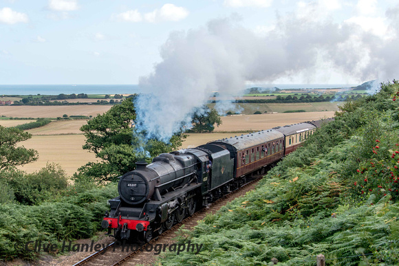 Stanier Black 5 no 45337 rounds the curve at the top of the Kelling bank.