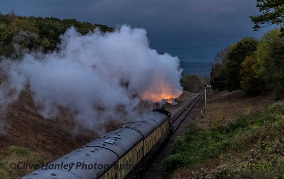 The rare sight of the glow from the firebox illuminating the steam as 7820 heads towards Winchcombe.