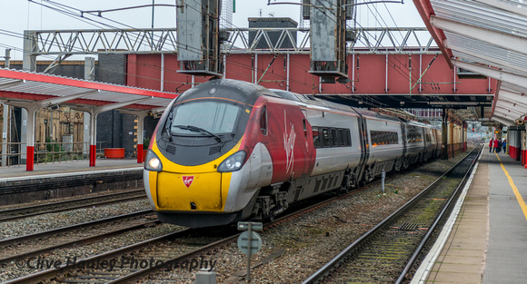 A Pendo roars through Crewe on the centre lines - 11.30am to Glasgow Central.