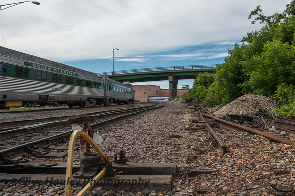 I took this shot to illustrate the last vestige of track work that led into the vast Rutland yards. Now a Walmart supermarket stands on the site. Its blank wall is visible through the bridge.