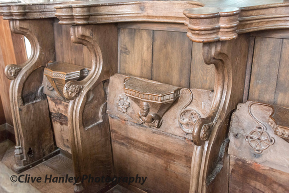 the Misericord seats behind which are the hidden panel paintings.