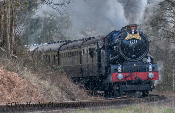 With Driver Duncan Ballard looking out from the cab 6023 King Edward II rounds the curve at Tenbury
