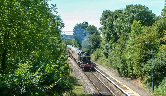 The train is next seen heading through Claverdon station.