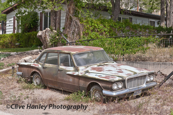 A "Dead" car. From my research I think it's a '62 Plymouth Valiant.