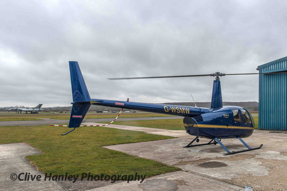 Ok I'm sulking now... A Robinson R44 helicopter came in to land at the Heliair base.