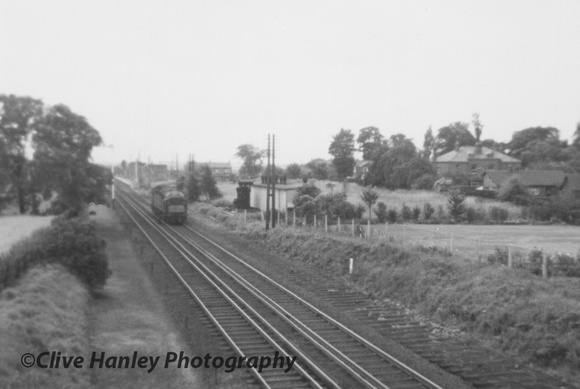 A Class 40 light engine heads north towards Preston after passing through Maghull station.