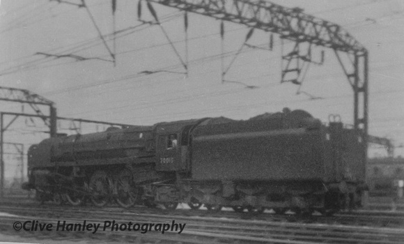 1964? 11 years old. The only photo I took of steam at Crewe! Britannia Class Pacific no 70015 Apollo runs light engine.
