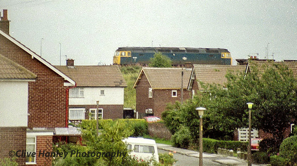 A view from my bedroom window in the 70's? up Church Road in Maghull. A Class 47 on a PW train.
