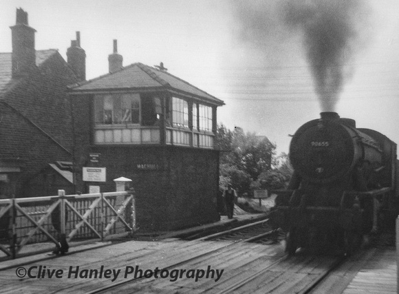 WD 2-8-0 no 90655 passes through Maghull station with a northbound freight from Liverpool docks.