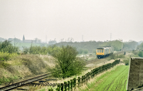 A zoom shot of the DMU heading north towards Rufford.