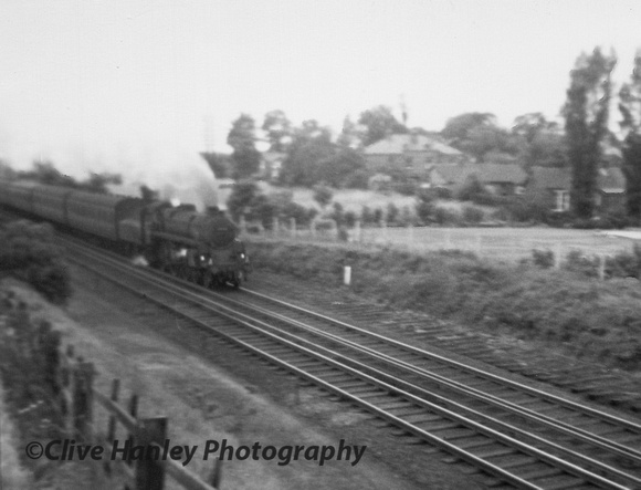 A Riddles Standard 4MT 4-6-0 approaches Poverty Lane bridge in Maghull with a northbound local.