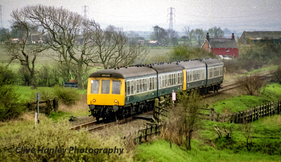 A 4 car "Special" excursion approaches the A581 bridge at Croston. A most unusual working.