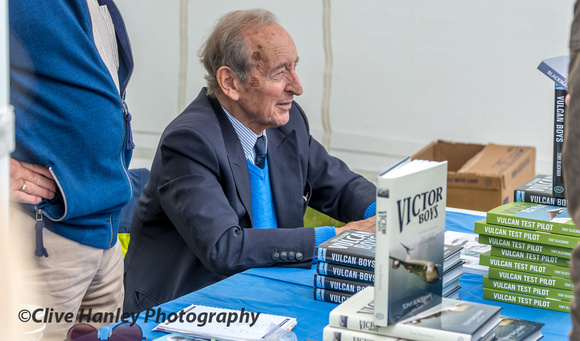 Avro Test Pilot Tony Blackman signs some of his books.