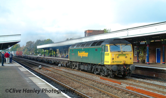 Class 57 no 57002 rolls through the centre road at Leamington Spa with a southbound container train.