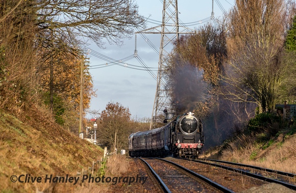 Standard 9F no 92214 has passed through swithland and is approaching Rothley station.