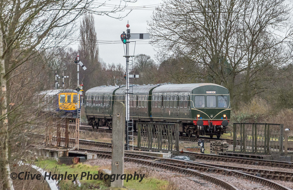 The DMU heads through Swithland and passes the on test hybrid train in the loop.