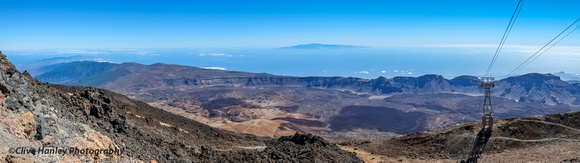The view of the caldera is stunning. Another island can be seen in the distance.