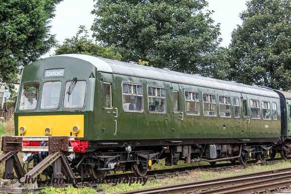 A newly painted Metro-Cammell DMU carriage sits in the sidings.