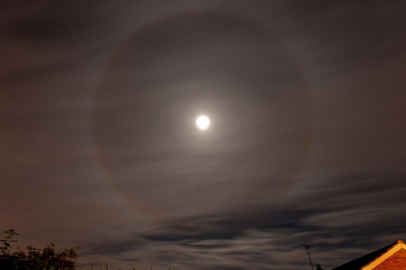 A moon ring, also known as a winter halo, is a phenomenon that usually appears in conjunction with a full moon.