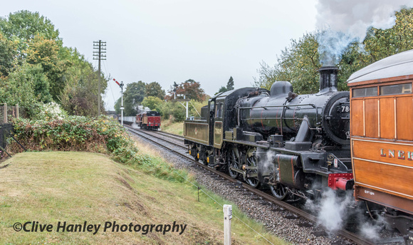 Stanier 8F no 48624 was held at the signals as Standard 2 no 78019 passed with the local service.