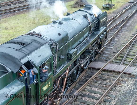 70013 has run up to Beeches Road bridge on its run around and is backing onto the stock in the loop.