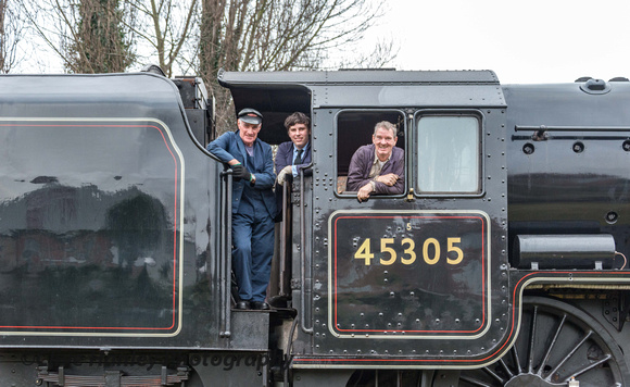 The crew look happy on the footplate of 45305