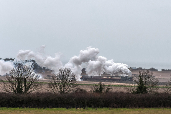 In the distance GWR Hall Class 4-6-0 no 4953 Pitchford Hall is on its way towards Weybourne.