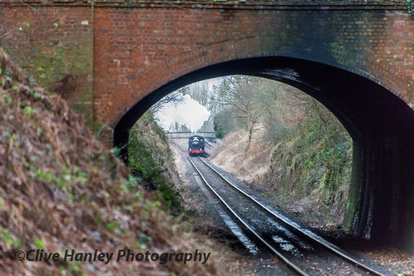Viewed through the short tunnel under the B4555 the summit of the line is visible.