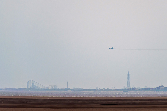 XH558 with Blackpool Tower and "The Big One" roller coaster.