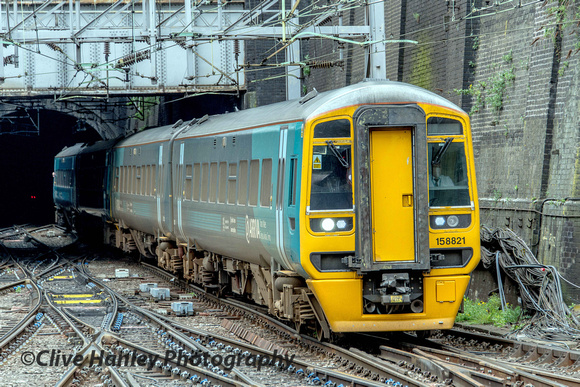 An Arriva Trains Wales service arrives from the north - Unit 158821