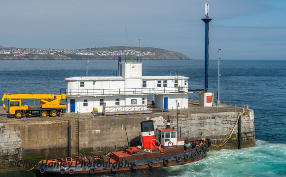 Coming into the harbour at Douglas where an old tugboat was moored.